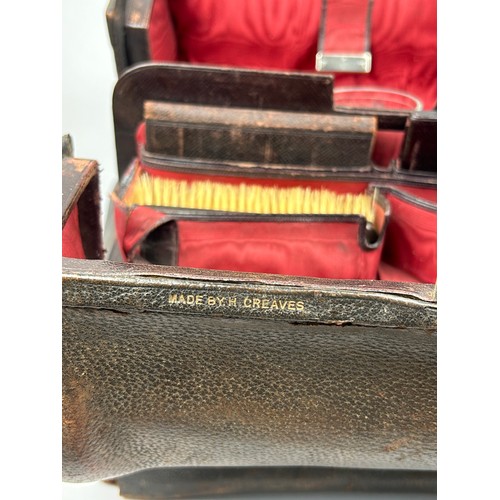 154 - A GENTLEMAN'S VANITY CASE, with silver topped bottles