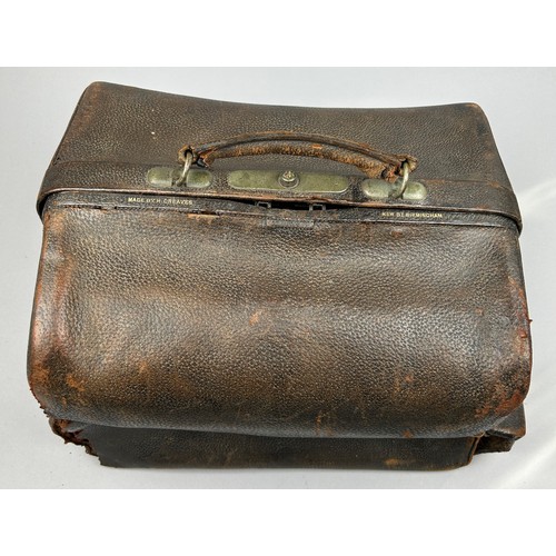 154 - A GENTLEMAN'S VANITY CASE, with silver topped bottles