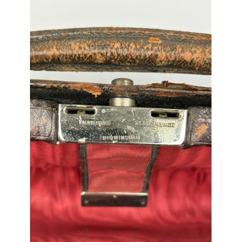 154 - A GENTLEMAN'S VANITY CASE, with silver topped bottles