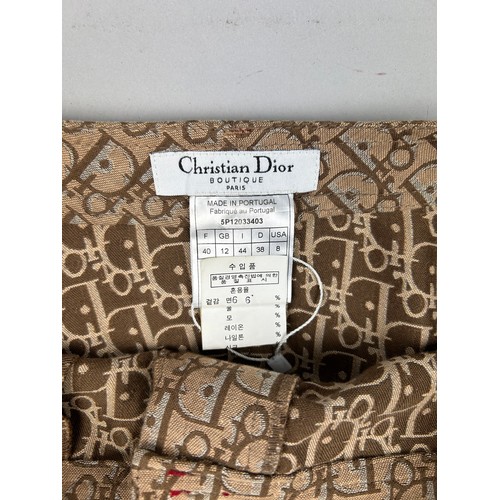 96 - A CHRISTIAN DIOR SKIRT WITH MONOGRAM EMBLEM THROUGHOUT 

GB size 12