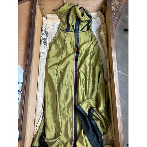 153 - A LARGE TRAVEL WARDROBE ON CASTORS CONTAINING DRESSES AND OUTFITS FROM THE 1940's-1960's including l... 