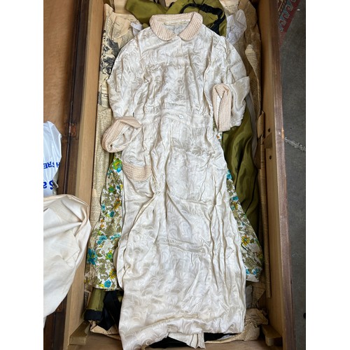 153 - A LARGE TRAVEL WARDROBE ON CASTORS CONTAINING DRESSES AND OUTFITS FROM THE 1940's-1960's including l... 