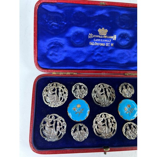 155 - CATCHPOLE AND WILLIAMS: A SET OF TWELVE ART NOUVEAU SILVERED METAL PINS, including two blue and gilt... 