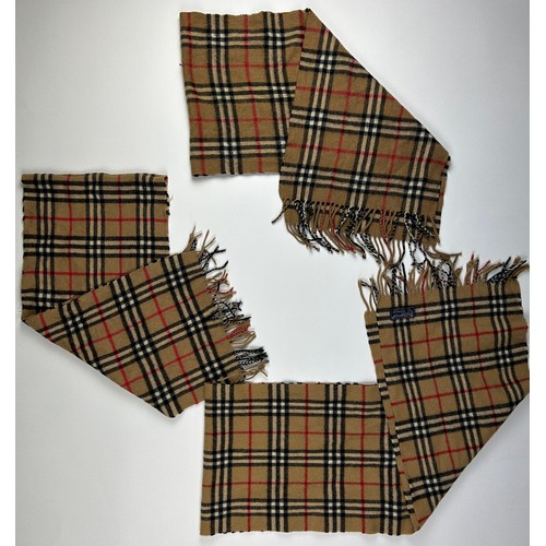 109 - A COLLECTION OF THREE BURBERRY WOOL SCARVES WITH NOVA CHECK PATTERN THROUGHOUT,