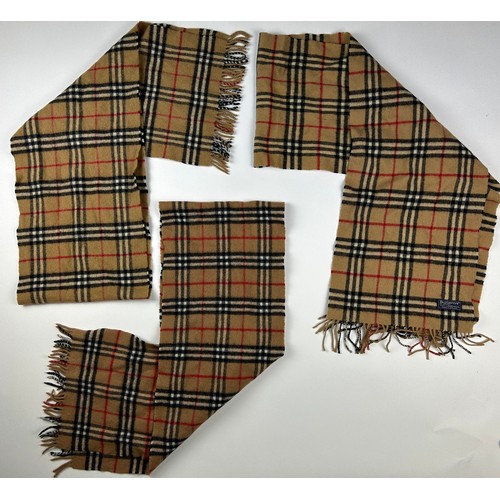 110 - A COLLECTION OF THREE BURBERRY WOOL SCARVES WITH NOVA CHECK PATTERN THROUGHOUT,