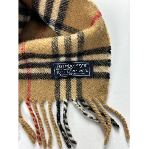 110 - A COLLECTION OF THREE BURBERRY WOOL SCARVES WITH NOVA CHECK PATTERN THROUGHOUT,