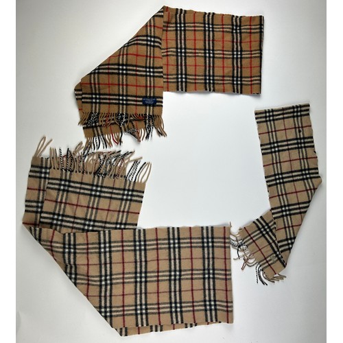 111 - A COLLECTION OF THREE BURBERRY WOOL SCARVES WITH NOVA CHECK PATTERN THROUGHOUT,