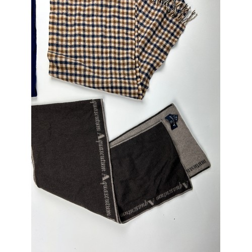 112 - A BURBERRY SCARF ALONG WITH TWO AQUASCUTUM SCARVES, 

The Burberry in navy blue with subtle crested ... 