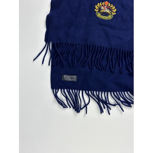 112 - A BURBERRY SCARF ALONG WITH TWO AQUASCUTUM SCARVES, 

The Burberry in navy blue with subtle crested ... 