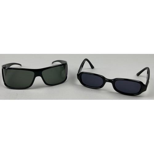 63 - TWO PAIRS OF BLACK GUCCI SUNGLASSES, both with Gucci emblems on each side