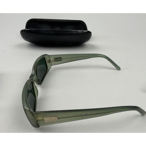 62 - THREE PAIRS OF GUCCI SUNGLASSES, one in a case. 

Interlocking GG hardware on two, and Gucci emblem ... 