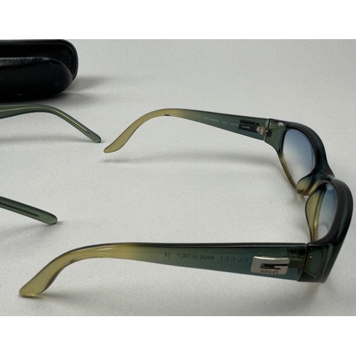 62 - THREE PAIRS OF GUCCI SUNGLASSES, one in a case. 

Interlocking GG hardware on two, and Gucci emblem ... 