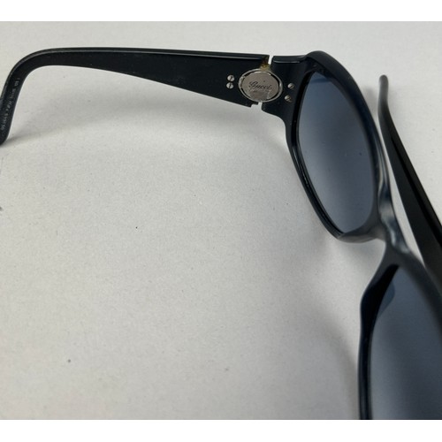 92 - TWO PAIRS OF BLACK AND BLUE GUCCI SUNGLASSES (2)