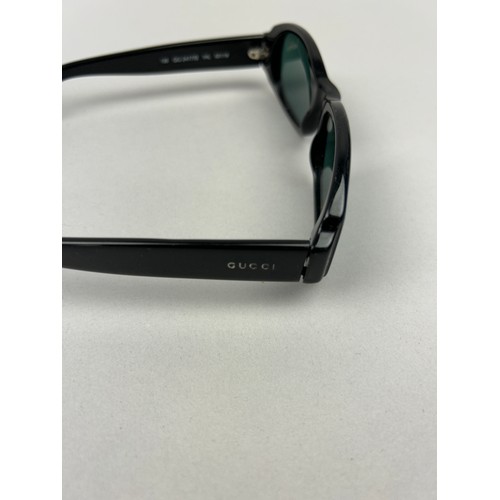 92 - TWO PAIRS OF BLACK AND BLUE GUCCI SUNGLASSES (2)