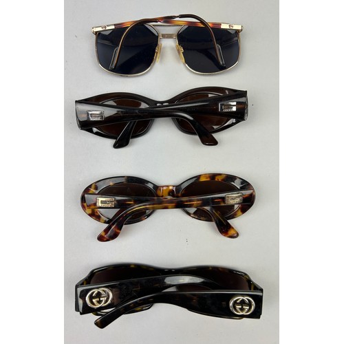 64 - FOUR VINTAGE GUCCI SUNGLASSES, three tortoiseshell and another brown pair.