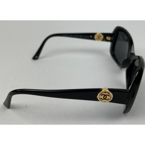 65 - TWO PAIRS OF VINTAGE CHANEL SUNGLASSES, one tortoiseshell the other black, both with interlocking 'C... 