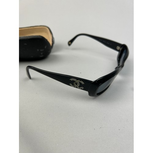 66 - A SET OF THREE CHANEL SUNGLASSES, one with diamanté interlocking 'CC' emblem on frames, another with... 