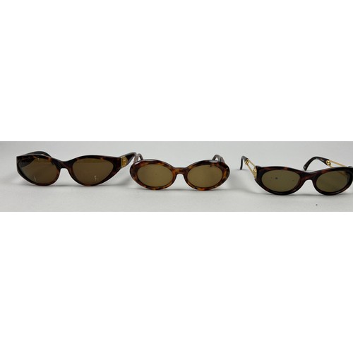 69 - THREE GIANNI VERSACE TORTOISESHELL DESIGN SUNGLASSES, all with gold 'Medusa head' detailing.