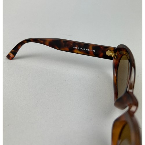 69 - THREE GIANNI VERSACE TORTOISESHELL DESIGN SUNGLASSES, all with gold 'Medusa head' detailing.