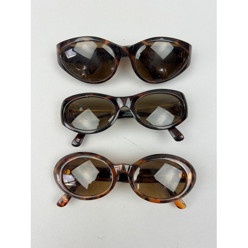 69 - THREE GIANNI VERSACE TORTOISESHELL DESIGN SUNGLASSES, all with gold 'Medusa head' detailing.