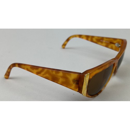 70 - A SET OF THREE VERSUS VERSACE SUNGLASSES, two orange and another with black frames and grey rims.

S... 