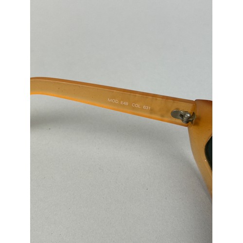 70 - A SET OF THREE VERSUS VERSACE SUNGLASSES, two orange and another with black frames and grey rims.

S... 