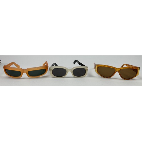 70 - A SET OF THREE VERSUS VERSACE SUNGLASSES, two orange and another with black frames and grey rims.

S... 