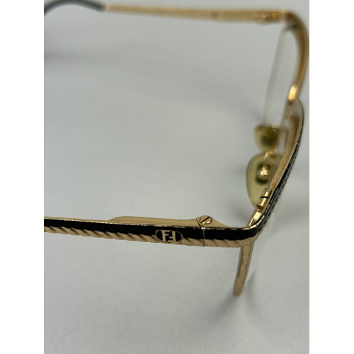 72 - THREE VINTAGE FENDI SUNGLASSES, all with interlocking 'FF' emblems to each side of frames. 

One a v... 