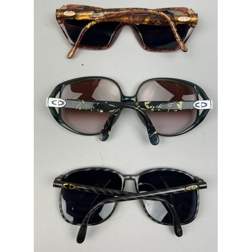 75 - THREE VINTAGE CHRISTIAN DIOR SUNGLASSES, various coloured frames and shades.