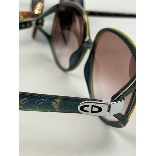 75 - THREE VINTAGE CHRISTIAN DIOR SUNGLASSES, various coloured frames and shades.