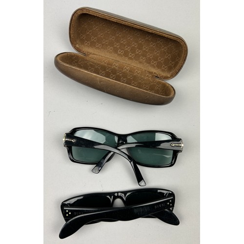 79 - TWO PAIRS OF BLACK GUCCI SUNGLASSES, one in original suede and velvet case