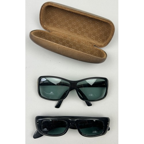 79 - TWO PAIRS OF BLACK GUCCI SUNGLASSES, one in original suede and velvet case