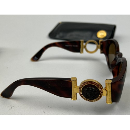 82 - FOUR PAIRS OF VINTAGE VERSACE SUNGLASSES, including one in a case with 'Medusa head' emblem (4)

One... 