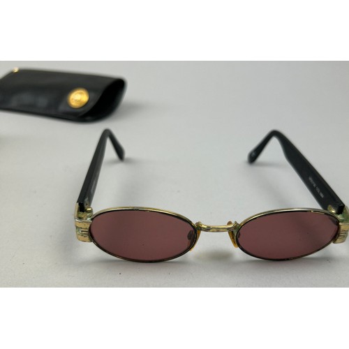 82 - FOUR PAIRS OF VINTAGE VERSACE SUNGLASSES, including one in a case with 'Medusa head' emblem (4)

One... 