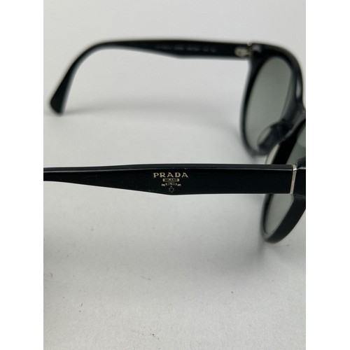 93 - TWO PAIRS OF PRADA BLACK SUNGLASSES (2)