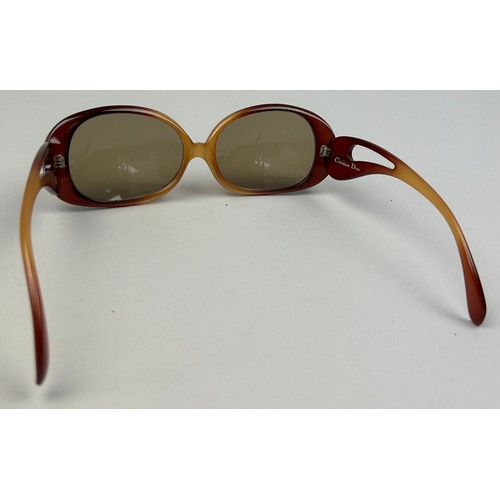 94 - A PAIR OF CHRISTIAN DIOR SUNGLASSES IN RED, with 'CD' monogram to frames