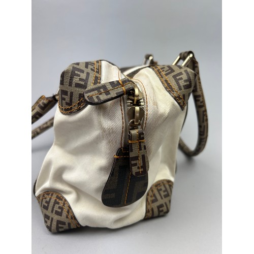 2 - A FENDI HANDBAG IN WHITE WITH BROWN LEATHER DETAILS, 'Zucca print' interlocking 'FF' throughout. Com... 