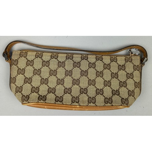 21 - A SMALL GUCCI SHOULDER BAG IN BEIGE, with interlocking 'GG' emblem throughout, tan leather strap and... 