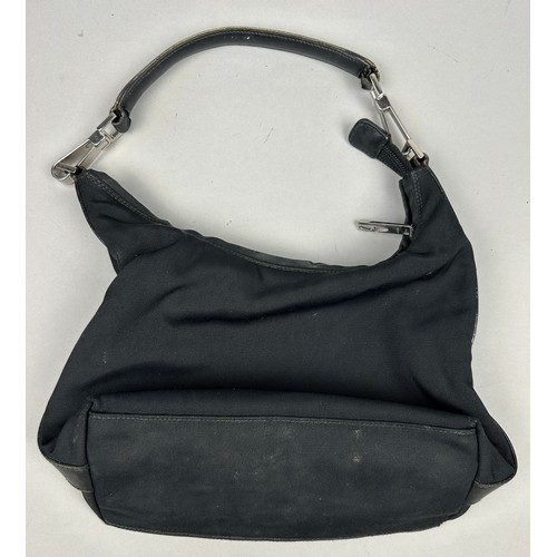 20 - A GUCCI BLACK HANDBAG, with silver coloured hardware

30cm x 20cm 

Good condition. Minimal signs of... 