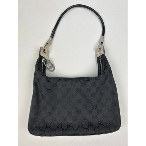 19 - A GUCCI SHOULDER BAG IN BLACK, with interlocking 'GG' monogram emblem throughout

25cm x 22cm 

Good... 