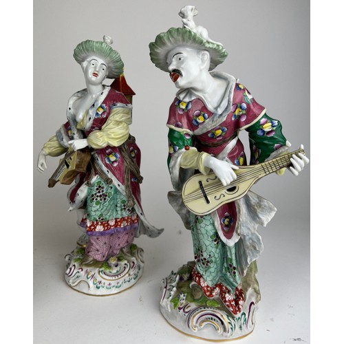 91 - A PAIR OF ROYAL VIENNA 'MALABAR MUSICIANS', playing instruments, marked underneath with Royal Vienna... 