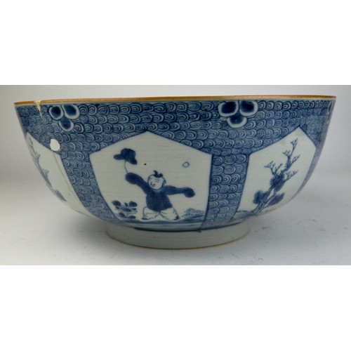 64 - A LARGE 18TH CENTURY CHINESE PORCELAIN BOWL, 

Blue and white painted depicting a boy at play. 

Var... 