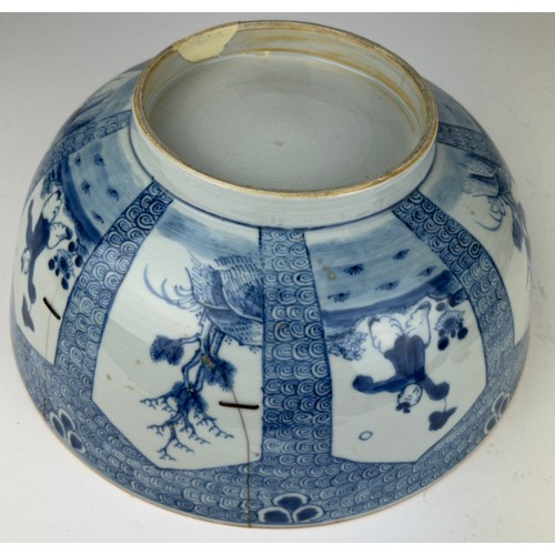 64 - A LARGE 18TH CENTURY CHINESE PORCELAIN BOWL, 

Blue and white painted depicting a boy at play. 

Var... 