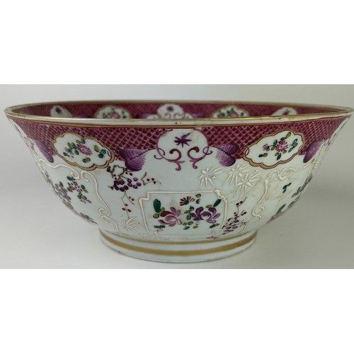 65 - A CHINESE EXPORT 'ARMORIAL' FAMILLE ROSE PUNCH BOWL, 

Painted with a coat of arms, and foliate desi... 