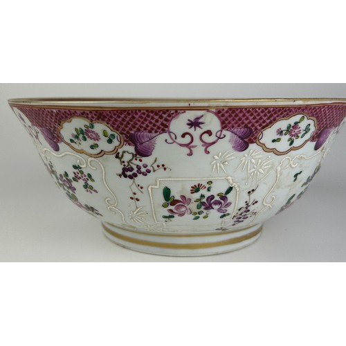 65 - A CHINESE EXPORT 'ARMORIAL' FAMILLE ROSE PUNCH BOWL, 

Painted with a coat of arms, and foliate desi... 