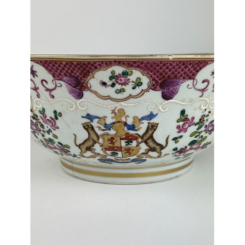 65 - A CHINESE EXPORT 'ARMORIAL' FAMILLE ROSE PUNCH BOWL, 

Painted with a coat of arms, and foliate desi... 