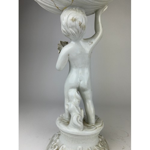 82 - A LARGE ENGLISH BLANC DE CHINE PORCELAIN FIGURE OF A PUTTI HOLDING A SCALLOP SHELL

Various damages ... 