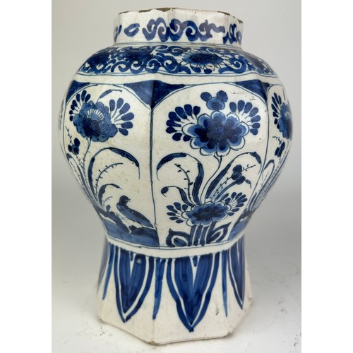 80 - A DUTCH DELFT VASE BLUE AND WHITE PAINTED WITH FLOWERS, octagonal shape probably 18th century.

24cm... 