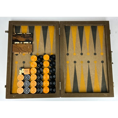 148 - AN ART DECO BACKGAMMON SET, cased

72cm x 54cm when open

**Please note this lot will be available f... 