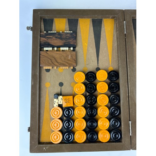 148 - AN ART DECO BACKGAMMON SET, cased

72cm x 54cm when open

**Please note this lot will be available f... 